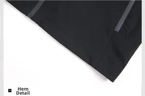 Close-up of the black windproof jacket hemline with seamless zipper detail