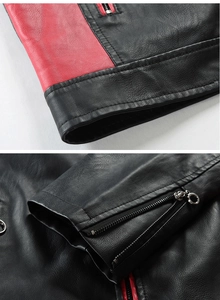 Detail view of red and black leather jacket showing metal zippers and premium texture