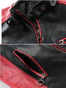 Detail of red and black leather jacket featuring stand collar and metal ring zipper