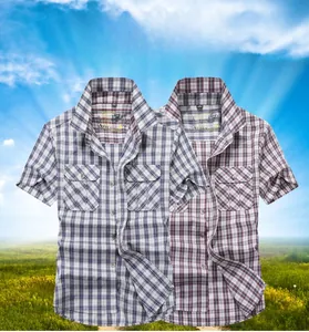 Detailed view of plaid short-sleeve shirts with classic collar and double breast pockets