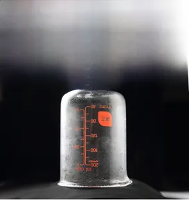 Close-up of a 200ml measuring cup showing vapor to demonstrate breathable fabric quality