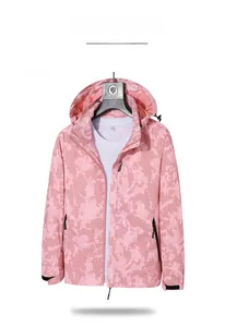 Detail of pink camouflage windbreaker featuring adjustable hood and velcro cuffs for women