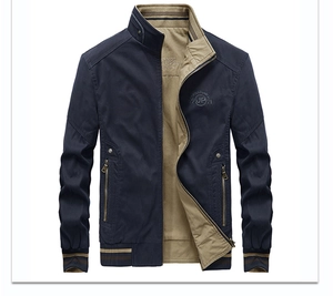 Detail of navy bomber jacket featuring embroidered chest logo and striped ribbed collar