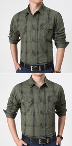 Detail of military green plaid shirt featuring double chest pockets and buttoned flaps
