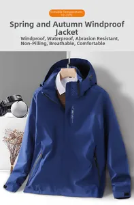 Detail view of blue hooded windbreaker jacket with EXPLORE chest print and waterproof fabric