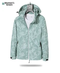 Detail of green hooded windbreaker jacket with honeycomb camo print and velcro cuffs