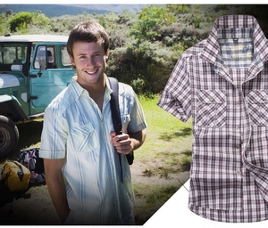 Detail of classic plaid pattern and double breast pockets on a men's summer short sleeve shirt