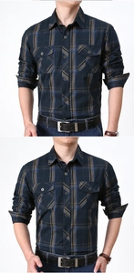 Detailed view of long sleeve plaid shirt with workwear style buttoned chest pockets