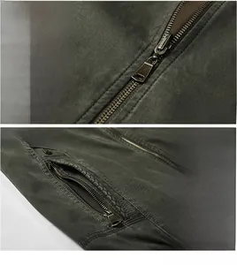 Detail of military green jacket featuring bronze metal zipper and secure side zip pockets