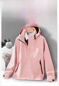 Detail of pink hooded windbreaker showing zipper and adjustable cuffs for outdoor wear