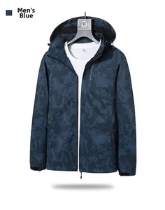 Detail of blue camo windbreaker jacket featuring hexagon grid pattern and EXPLORE text