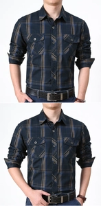 Detail of navy blue plaid long sleeve shirt with dual chest pockets and turn-down collar