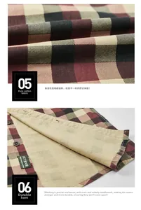 Détail d'une chemise en coton à carreaux rouge et noir avec étiquette et couture fine