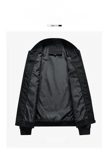 Detail of black bomber jacket showing ribbed stand collar and smooth quilted inner lining