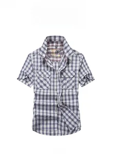 Detailed view of casual plaid short sleeve shirt with classic button-down chest pockets