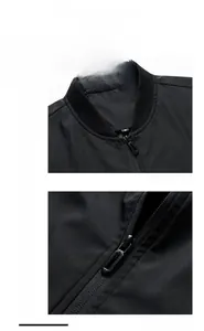 Detail view of the ribbed stand collar and metallic zipper on this black casual jacket