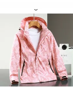 Detail of pink camouflage outdoor jacket with zipper pockets and adjustable cuffs