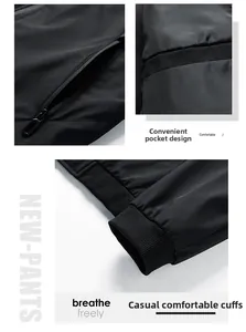 Detail view of black casual jacket featuring zipper pockets and ribbed elastic cuffs