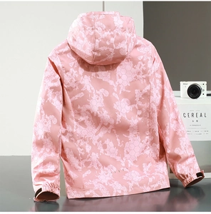 Detail view of pink camouflage outdoor jacket with waterproof honeycomb pattern and elastic cuffs