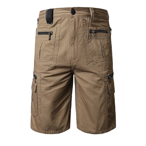 Detailed close-up of khaki cotton cargo shorts featuring multiple secure zipper pockets