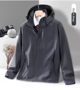 Detailed view of grey windproof outdoor jacket with hooded collar and chest print