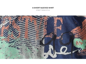 Macro detail of navy blue short sleeve shirt fabric with street trend graffiti print