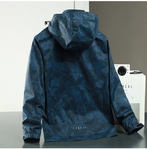 Detail of adjustable velcro cuffs and reflective stripe on camo windbreaker jacket