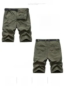 Detail view of army green cargo shorts featuring multiple zip pockets and nylon belt