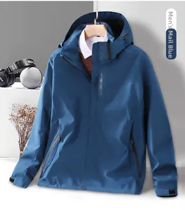 Detail of post blue hooded windbreaker showing zippered pockets and adjustable cuffs