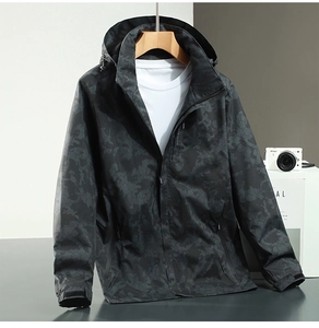 Close-up of a men's camouflage windbreaker jacket with waterproof honeycomb texture