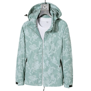 Mens light green camouflage hooded windbreaker jacket with geometric camo pattern