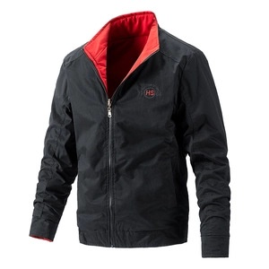 Detail of men's reversible stand collar jacket with Hunter Story logo and red lining