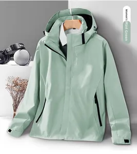 Close-up of sage green women's hooded outdoor jacket with windproof fabric and detail