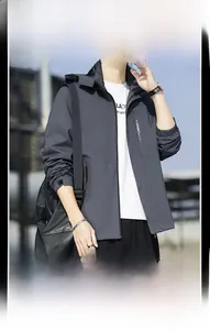 Detail of dark grey waterproof hiking jacket with functional zipper and stylish hood