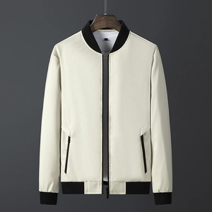 Minimalist beige men's baseball collar jacket with black ribbed trim and zipper pockets
