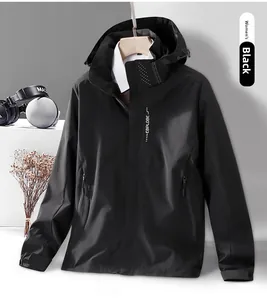 Detail of black women's outdoor windbreaker with hood and EBPLOBE logo on chest