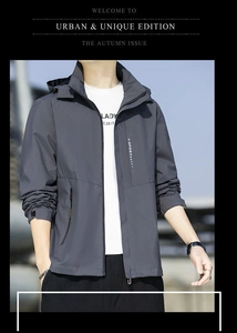 Detail of gray hooded outdoor jacket with zipper and X-SPORT text on the chest