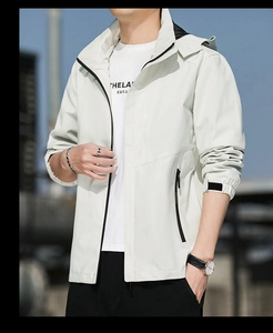 Close-up of waterproof hooded jacket with zipper and decorative vertical lettering detail