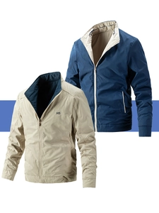 Detail of reversible standing collar jacket showing metal zipper and HS logo embroidery