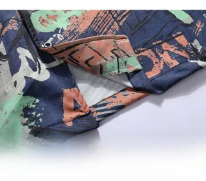 Close-up of men shirt hem with neat double stitching and colorful abstract graffiti print