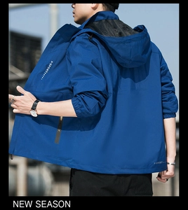 Detail of navy waterproof mountain jacket with breathable mesh lining and X-SPORT logo