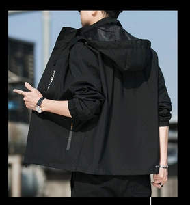 Detail of waterproof outdoor jacket featuring adjustable hood and X-SPORT printed text