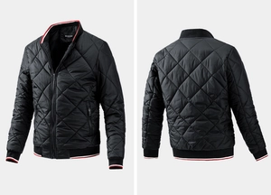 Detail of black quilted bomber jacket featuring red and white striped ribbed cuffs and collar