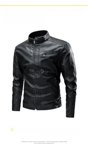 Close-up of quilted shoulder texture and metal zipper pockets on black faux leather jacket