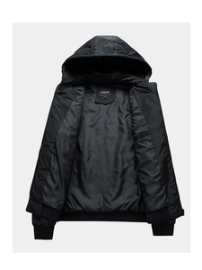 Detailed close-up of men's black hooded jacket interior with fabric brand label and size tag