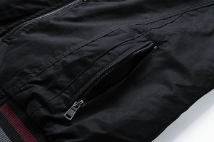 Detail of men's cotton jacket with zipper pocket and tricolor striped ribbed hem