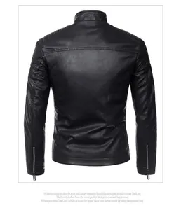 Detail view of the quilted shoulder design and zipper cuffs on black biker jacket