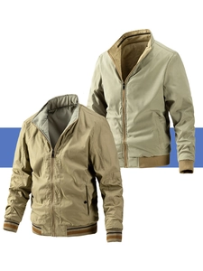 Detail of men's reversible bomber jacket with striped ribbed cuffs and zip closure