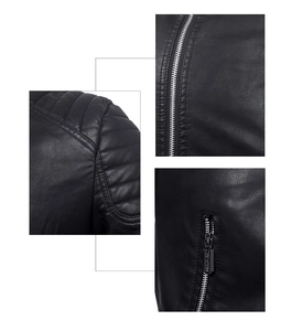 Detail view of black leather jacket featuring shoulder quilting and metal zipper hardware