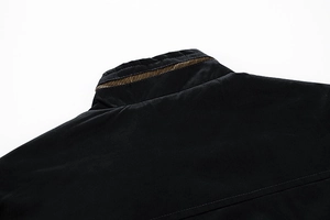 Detailed close-up of men's black stand collar jacket with golden metal zipper and suede texture
